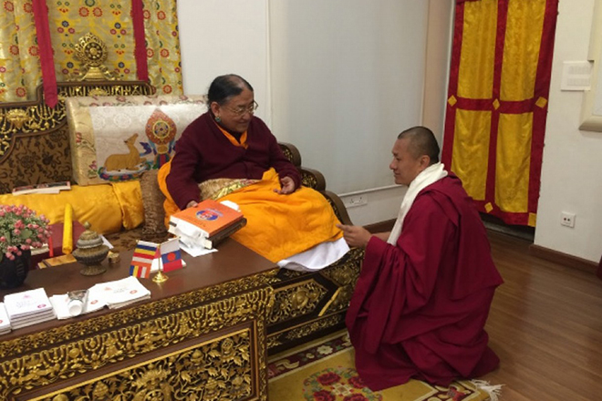 Offering a text to His Holiness Sakya Trizin