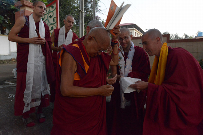 Offering a new publication to Kyabje Lama Zopa Rinpoche